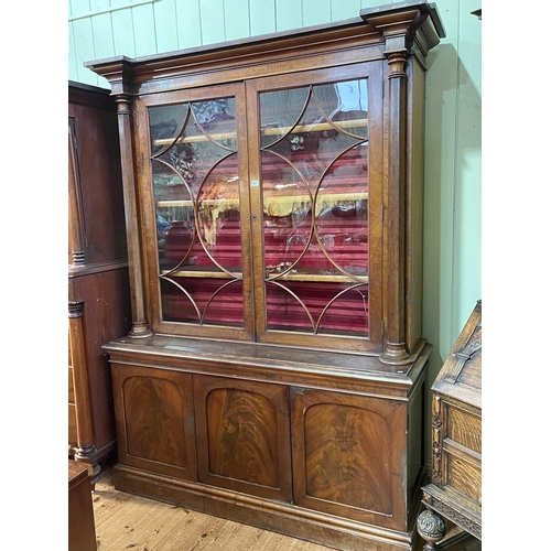 403 - Victorian mahogany cabinet bookcase having two glazed panel doors enclosing adjustable shelves above... 