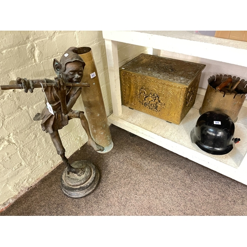 103 - Bronzed Pixie sculpture, shell casing stand, brass embossed coal box, helmet, etc.