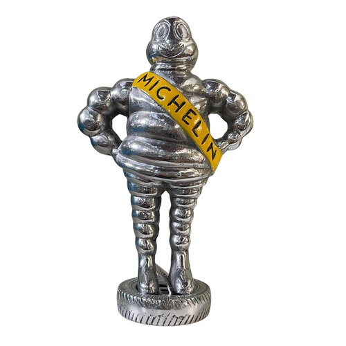 65 - Small chromed model of the Michelin Man.