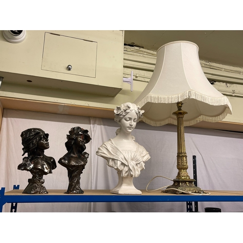 116 - Three ornate busts and a brass table lamp.