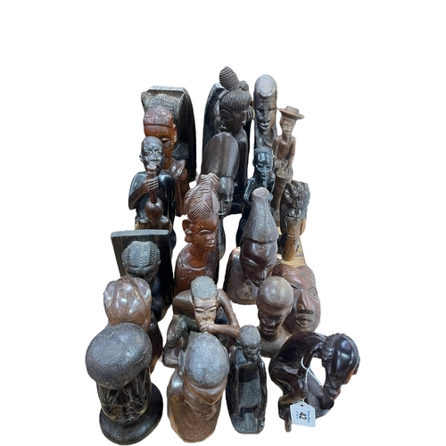 42 - Assortment of African carved sculptures including busts.