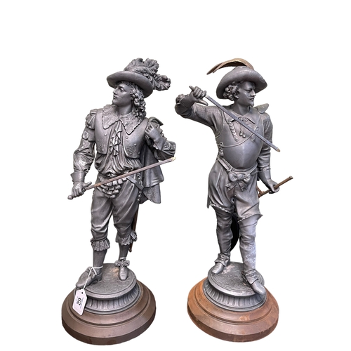 62 - Two cast metal Cavalier sculptures, 51cm highest.