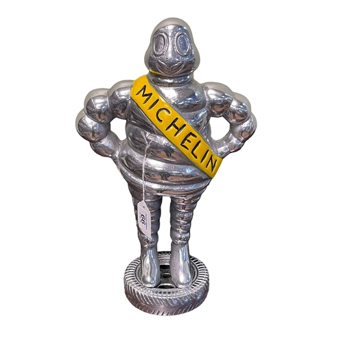 66 - Silver coloured Michelin Man doorstop, 37cm.