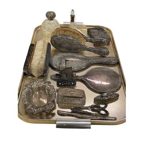 1 - Silver backed brushes and mirrors, silver topped toilet jars, pierced bon bon dish, etc.