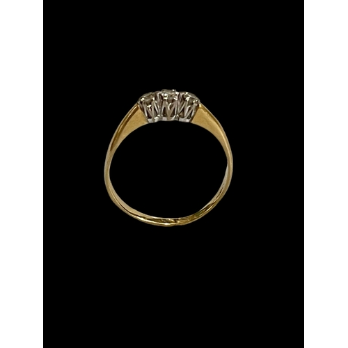 166 - Three stone diamond and 18 carat gold ring, size R.