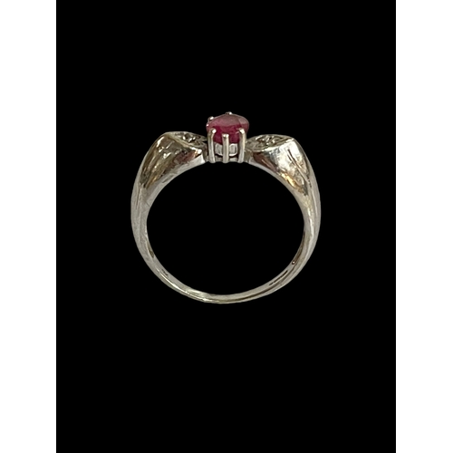 167 - Ruby and diamond 9 carat white gold ring, size P.