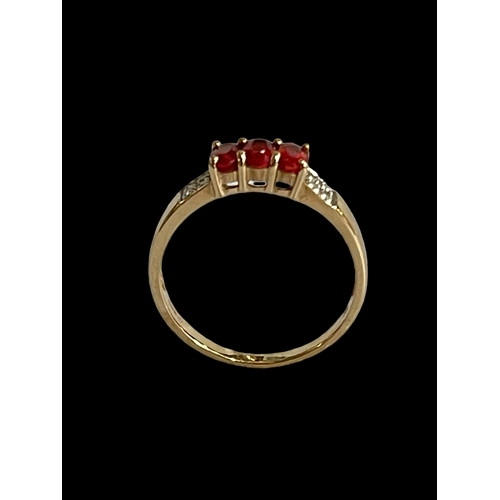 173 - Ruby and diamond 9 carat gold ring, size S.