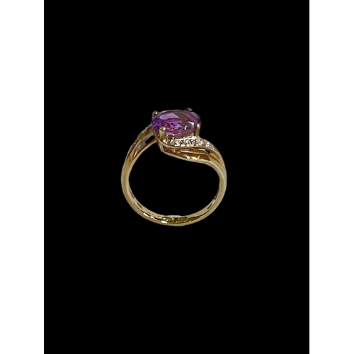 203 - Amethyst and diamond 9 carat gold ring, size L.