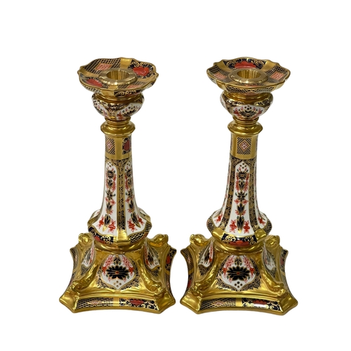 249 - Pair of Royal Crown Derby Imari 1128 pattern candlesticks, 27cm.