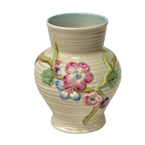 255 - Clarice Cliff vase with raised floral decoration.