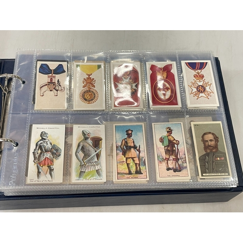 267 - Album of Guinea Gold and Military themed cigarette cards.