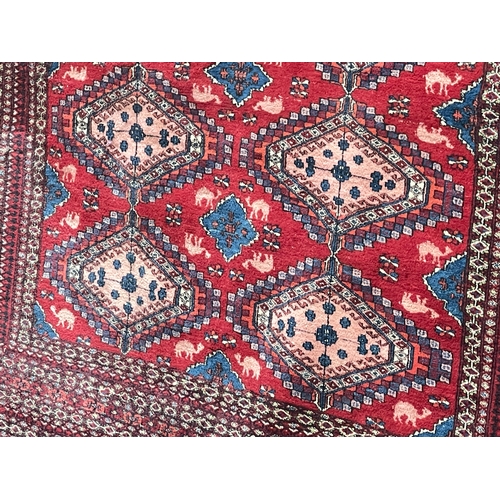 292 - Red ground Eastern design carpet 3.00 by 2.23.