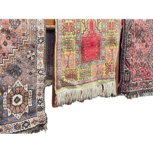 293 - Three various Eastern design rugs, largest 2.00 by 1.36.