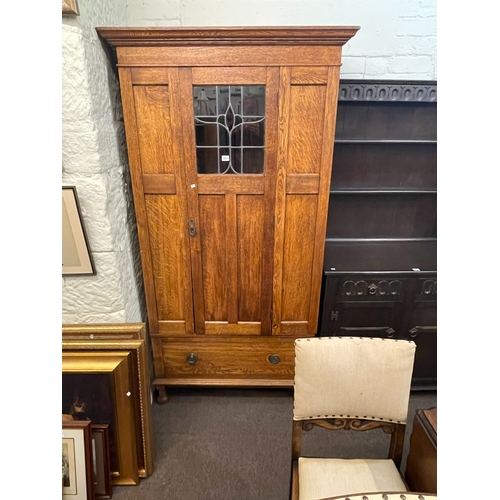 303 - 1920's oak wardrobe with leaded glass panel door, 194cm by 100.5cm by 50cm.