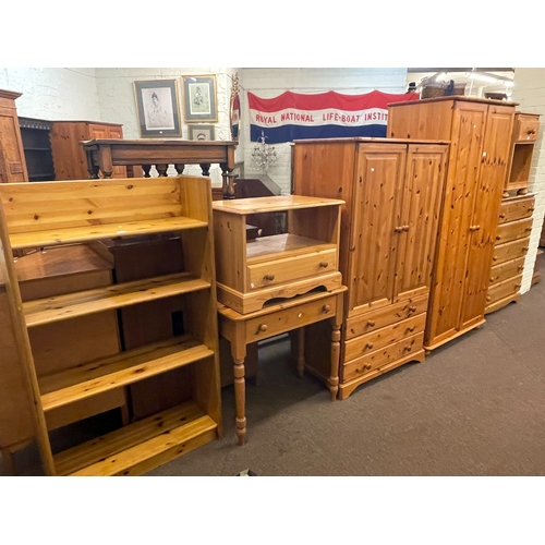 313 - Collection of pine furniture to include two wardrobes, five drawer chest, dressing table, pedestal, ... 