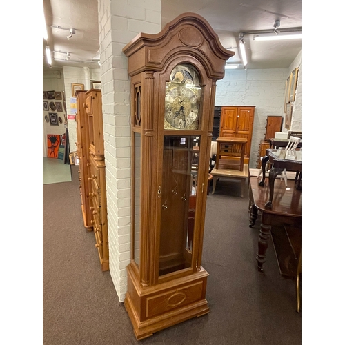 314 - Kieninger oak cased triple weight longcase clock having arched moon phase dial, 208cm.