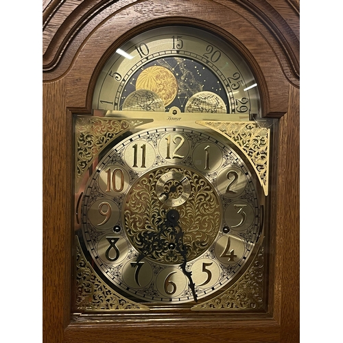 314 - Kieninger oak cased triple weight longcase clock having arched moon phase dial, 208cm.