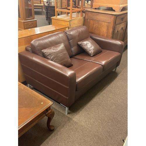 320 - Contemporary chocolate brown leather two seater settee.