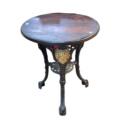 331 - Cast base circular pub table, 70cm by 61cm diameter.