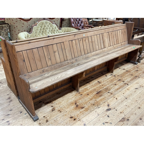 340 - Pitch pine church pew, 273cm.