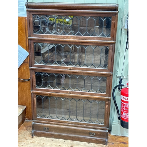 343 - Oak Globe Wernicke four height stacking bookcase with leaded glass doors and base drawer, 146.5cm by... 