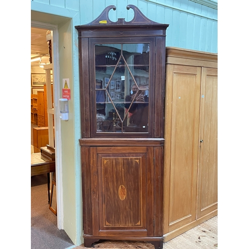 375 - Edwardian inlaid mahogany standing corner cabinet having astragal glazed door above an inlaid panel ... 