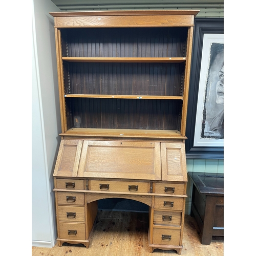 377 - Early 20th Century oak bureau bookcase, the open top above a fall front with two folding sides with ... 