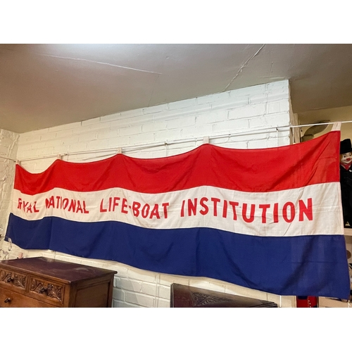 91 - Two large RNLI flags, assorted helmets, ammunition boxes, nautical items including caps, etc.