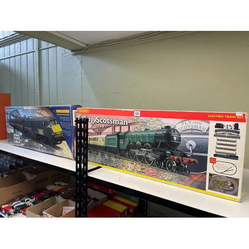 Two boxed model train sets, GNER225 and Flying Scotsman.