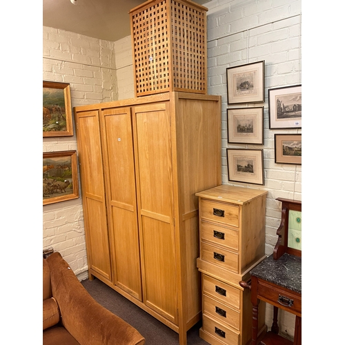 380 - Contemporary light oak three door wardrobe, 200cm by 150cm by 57cm, pair three drawer pedestal chest... 