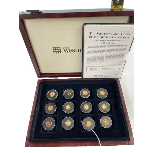 128 - A collection of commemorative coinage, to include; a cased set 'Smallest Gold Coins of the World' co... 