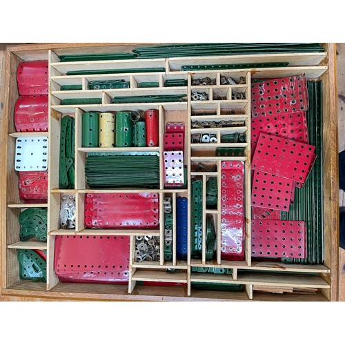 137 - Collection of Meccano in wooden cabinet.