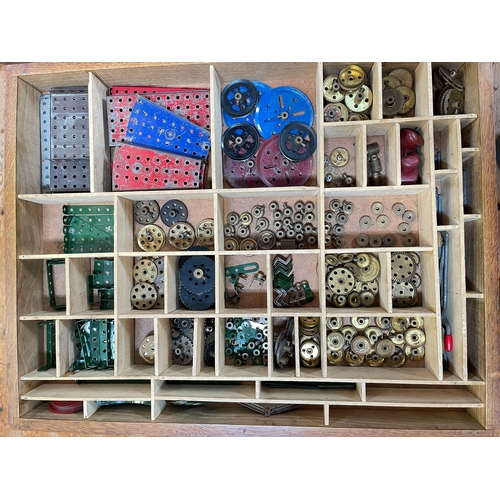 137 - Collection of Meccano in wooden cabinet.