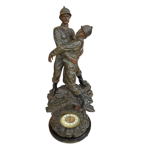 143 - Ornate spelter clock depicting fireman, label reads 'Victime Du Devoir, Par X Raphanel', 80cm.