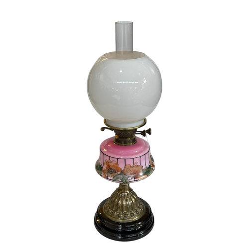 144 - Victorian oil lamp with pink glass floral reservoir, 61cm.