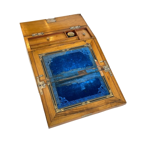 151 - Ornate Victorian walnut and brass mounted writing slope with porcelain cherub insert, 30cm by 11cm.