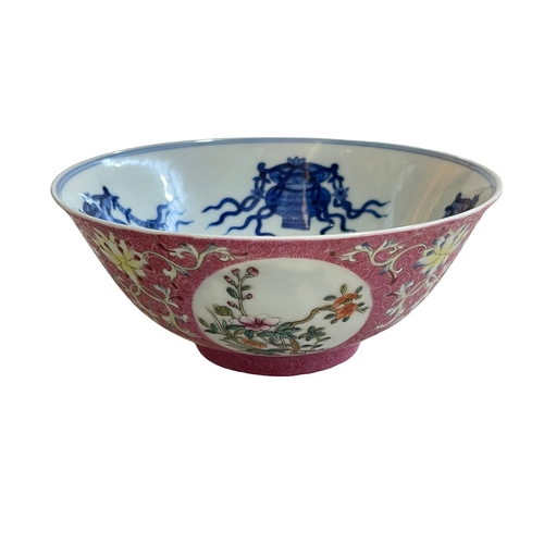 160 - Chinese famille rose decorated bowl with blue and white interior decoration, six character mark to b... 