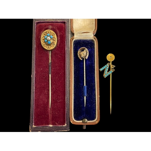 168 - Three Victorian stick pins, one fox mask, others with turquoise.