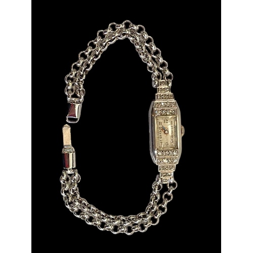 169 - Diamond set platinum cocktail watch with 9 carat white gold bracelet.