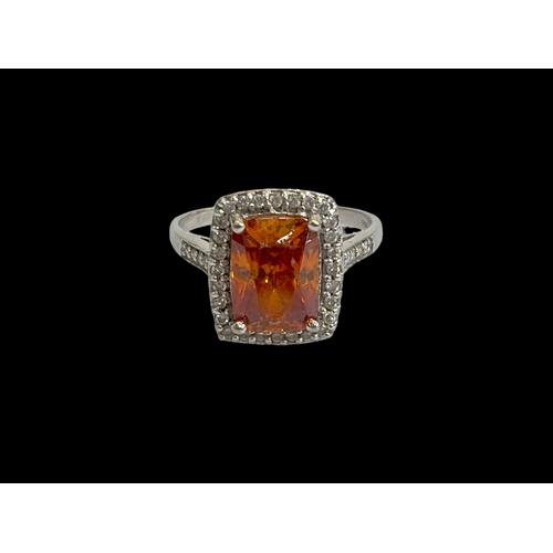 172 - Citrine and diamond 18 carat white gold ring, size S.