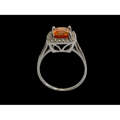 172 - Citrine and diamond 18 carat white gold ring, size S.