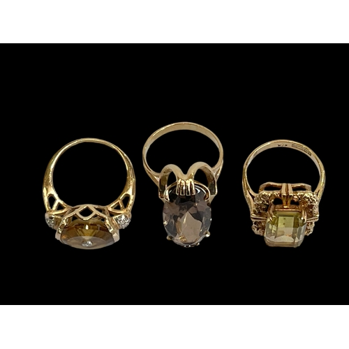 174 - Three 9 carat gold large gem stone rings.