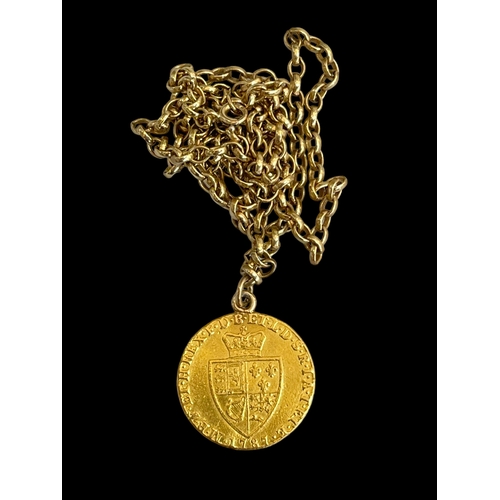 207 - George III gold guinea 1787 on 9 carat gold chain, 60cm length.
