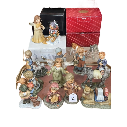 14 - Eleven Berta Hummel figures, Goebel musical figure Ride into Christmas, Calf and Donkey.