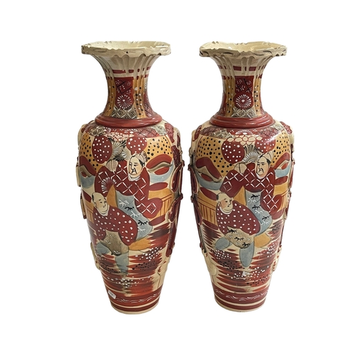 124 - Pair colourful Satsuma vases decorated with figures, 48cm.