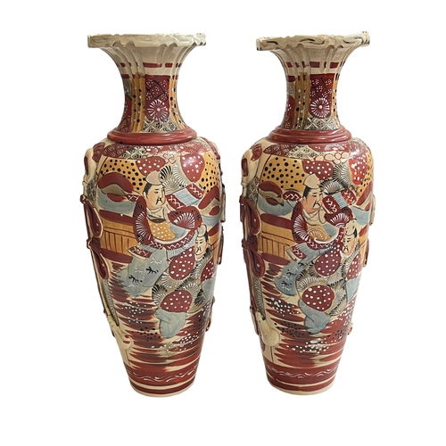 124 - Pair colourful Satsuma vases decorated with figures, 48cm.