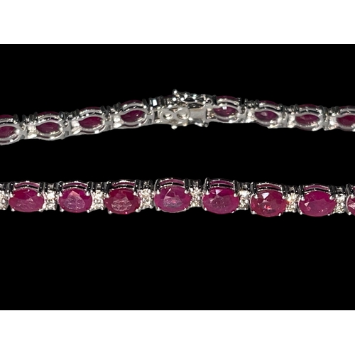 128 - 18 carat white gold, ruby and diamond bracelet, over 10 carats of rubies.