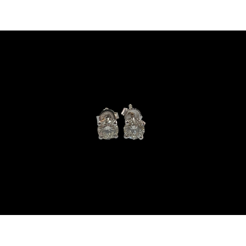 132 - Pair of 18 carat white gold and diamond earrings, diamond 1.01 carats.