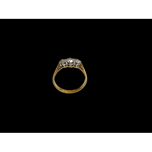 140 - Diamond three stone 18 carat gold ring, size M.