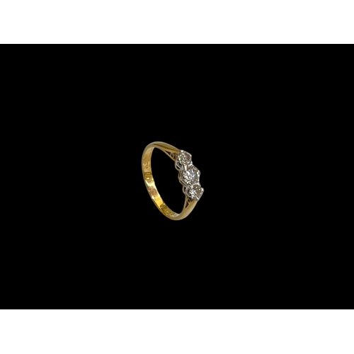 140 - Diamond three stone 18 carat gold ring, size M.